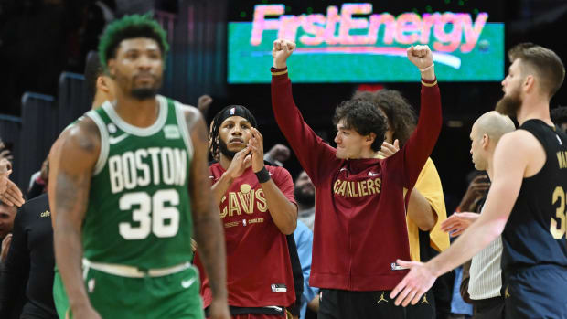 Nov 2, 2022; Cleveland, Ohio, USA; Cleveland Cavaliers forward Cedi Osman (16) celebrates as Boston Celtics guard Marcus Smart (36) walks off the court after the Cavaliers beat the Celtics at Rocket Mortgage FieldHouse. Mandatory Credit: Ken Blaze-USA TODAY Sports